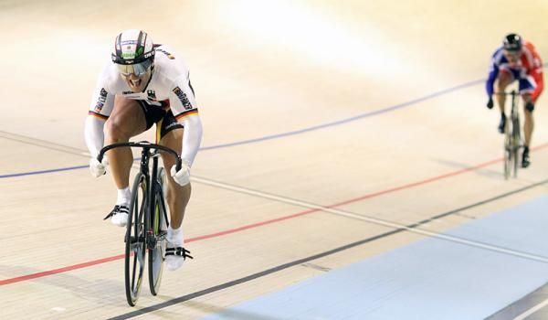 Robert Forstemann (Germany) attacks early to build an unassailable lead on Chris Hoy (Great Britain) in the 1/8 final of the men's sprint.