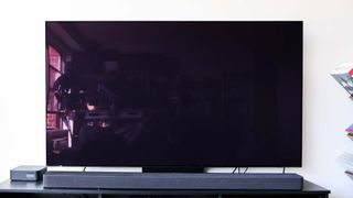 Samsung S90D OLED TV on table in living room