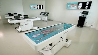 Within the Anamatage Lab, each table is capable of displaying horizontal slices of the human body to reveal bone structure, nerves, muscle, and veins without having to physically dissect a body. The NAV system enables content to be captured and distributed to remote locations over the university network. 