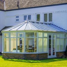Glass conservatory on back of house 