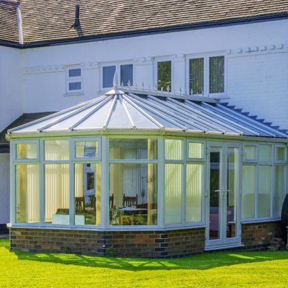 Glass conservatory on back of house 