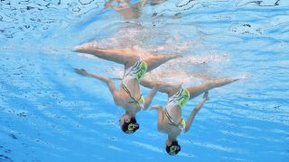 Liuyi Wang and Qianyi Wang of Team China compete in the Women's Duet Technical Final on day four of the Doha 2024 World Aquatics Championships ahead of the 2024 Paris Olympics