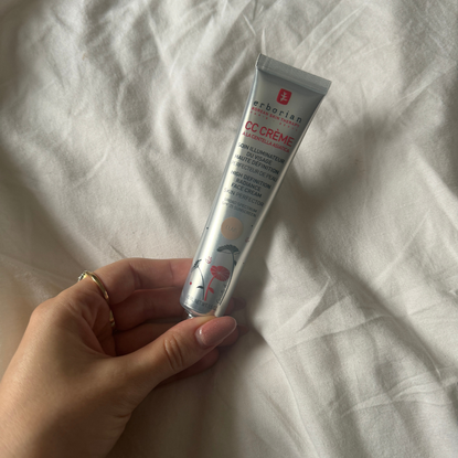 Rebecca Fearn holding a tube of the Erborian CC Cream