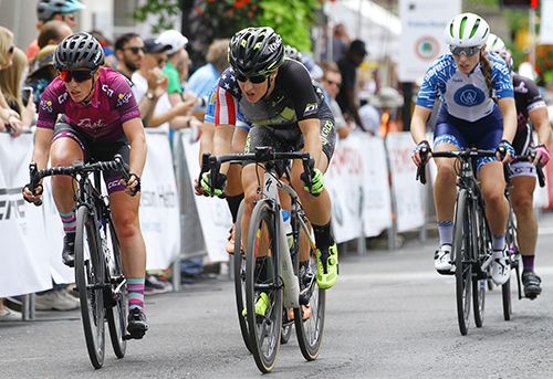 Colleen Gulick (Pickle Juice Pro Cycling Team) looks ahead down the straight-a-way, mid-pack.