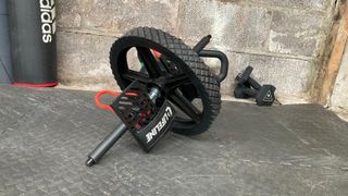 Lifeline Power Wheel Ultimate Core Trainer being tested on rubber floor