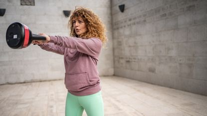 Woman doing a kettlebell swing