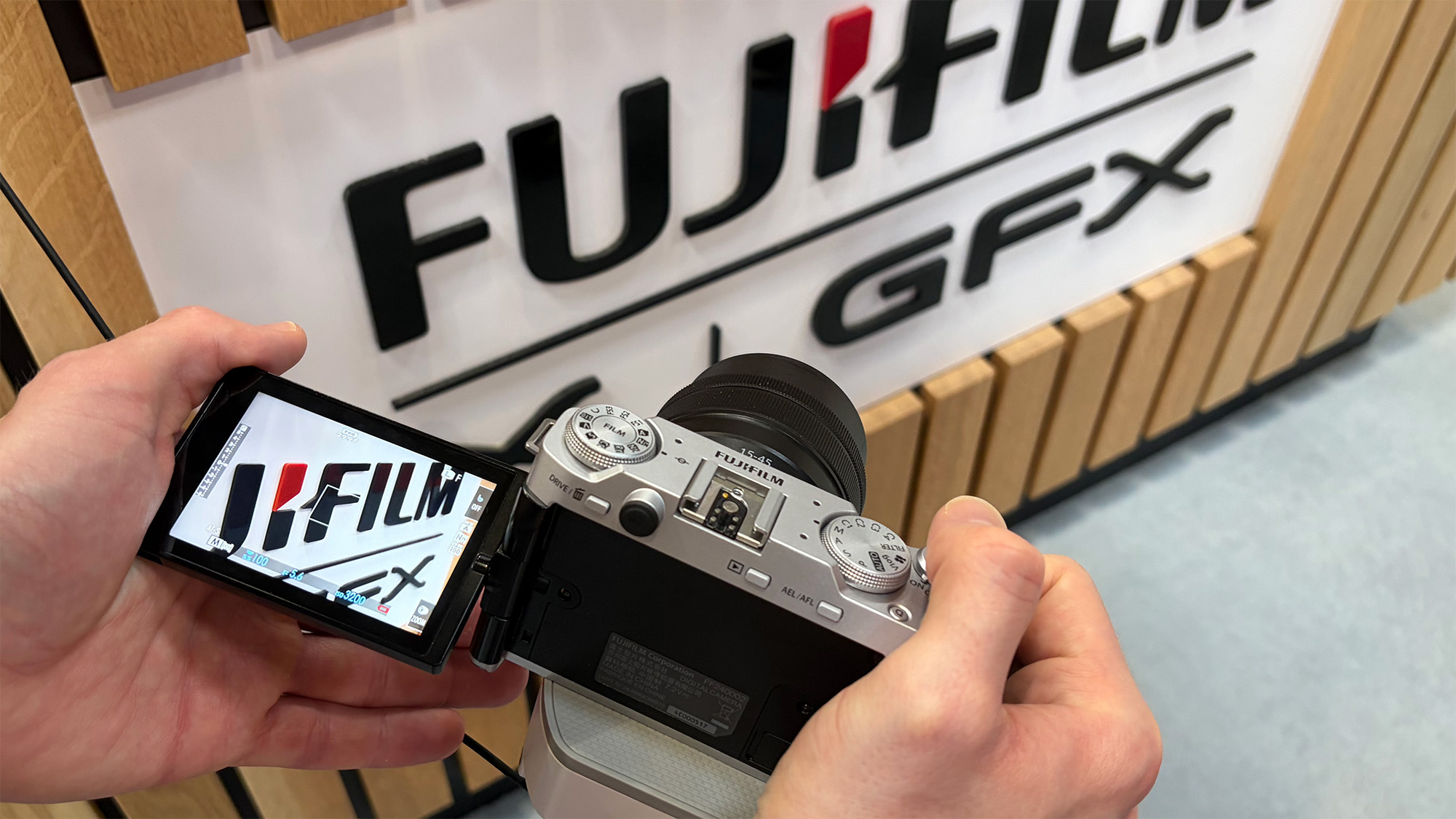 Mike Harris handling Fujifilm X-M5 on trade-show floor