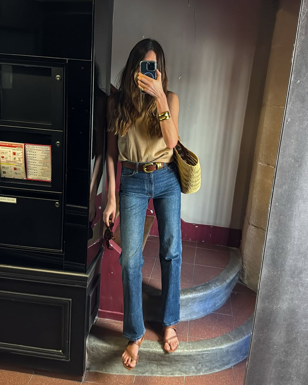 Sara is wearing toe post sandals