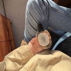 Shannon Lawlor holding Diptyque Orph&eacute;on Eau de Toilette