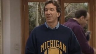 Tim Allen wearing a football sweatshirt in Home Improvement