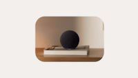 The Amazon Echo Dot 2026 sitting on a book on a table.