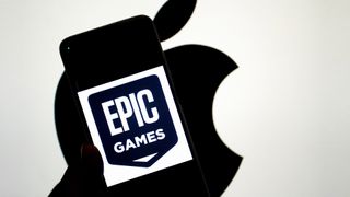 INDIA - 2024/09/14: In this photo illustration, an Epic Games logo seen displayed on a smartphone with an Apple logo in the background. The relationship between Epic Games and Apple became widely known due to a legal dispute. In 2020, Epic Games, the creator of the popular game Fortnite, challenged Apple's App Store policies by introducing a direct payment option in Fortnite, bypassing Apple's 30% commission on in-app purchases. Apple responded by removing Fortnite from the App Store, leading to a major lawsuit. Epic accused Apple of anti-competitive behavior, claiming that the company had a monopoly on app distribution and payments within its ecosystem. The case, which addressed broader issues of app store policies and digital marketplaces, attracted significant attention and sparked debate about the control tech giants have over their platforms. (Photo Illustration by Avishek Das/SOPA Images/LightRocket via Getty Images)