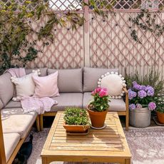 pink garden with outdoor furniture and flowers