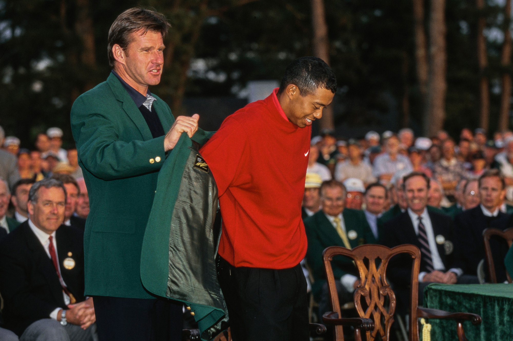 Nick Faldo placing the Green Jacket on Tiger Woods in 1997