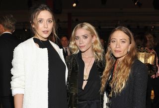 Ashley, Mary-Kate, and Elizabeth Olsen posing together at a LACMA event.