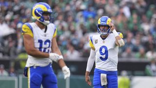 Los Angeles Rams quarterback Matthew Stafford talking to wide receiver Puka Nacua