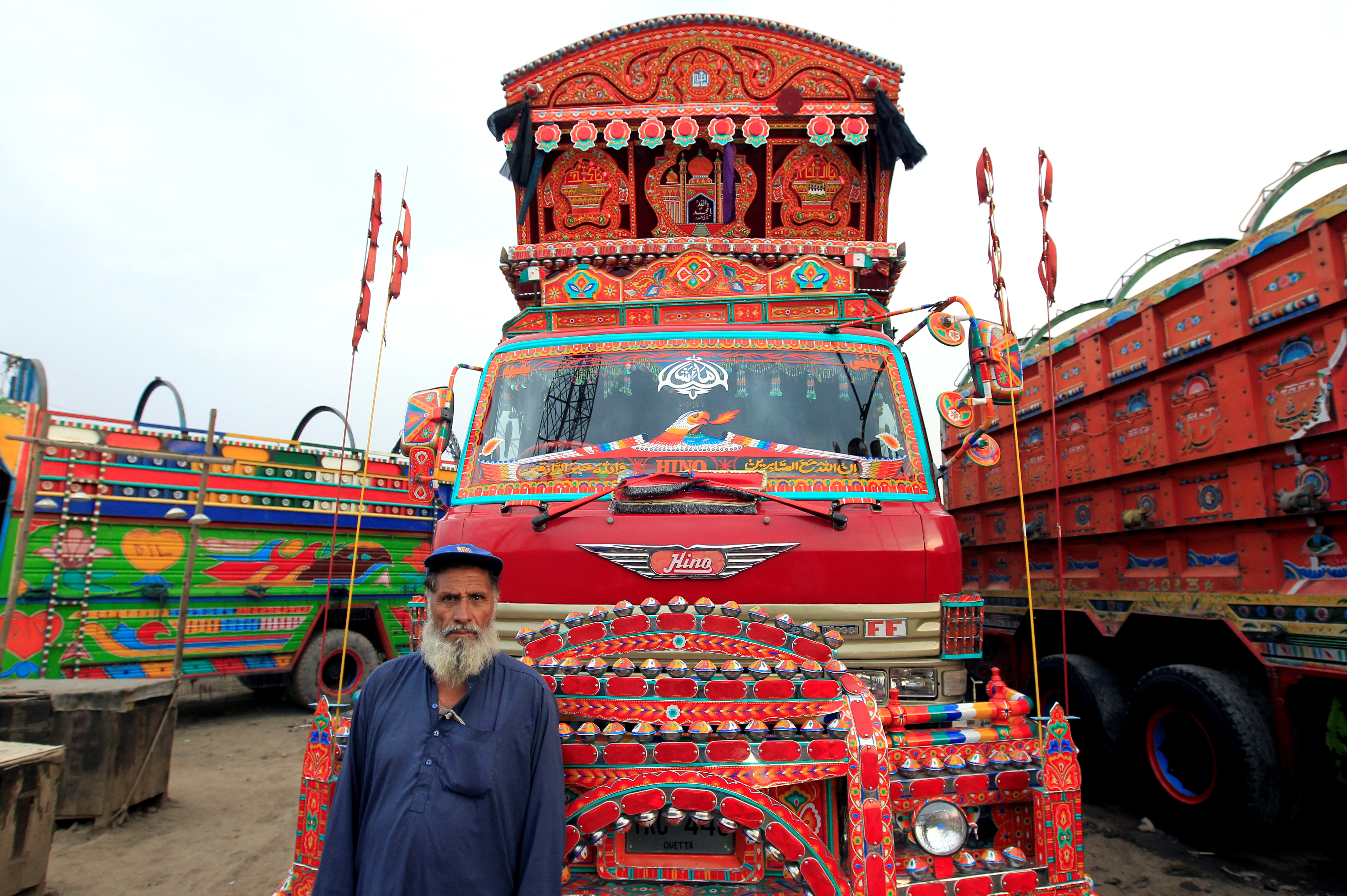 Security guard standing in front of truck.