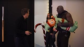 Mantis and Drax (with gifts) surprise Kevin Bacon in The Guardians of the Galaxy Holiday Special