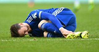 James Maddison clutches his ankle during Leicester's win against Aston Villa