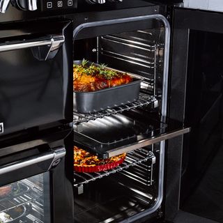 Quad Oven with Proflex Splitter, showing one side of the oven open with food roasting inside