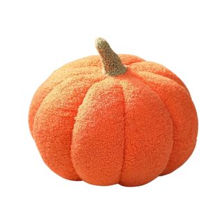 An orange pumpkin pillow