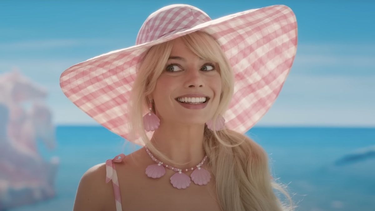 Margot Robbie&#039;s Barbie smiling on beach