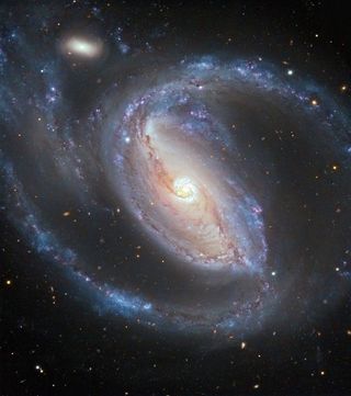 Seyfert galaxy NGC 1097 and companion NGC 1097a