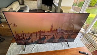 TCL P755K 65-inch 4K TV top down angle showing Venice on screen