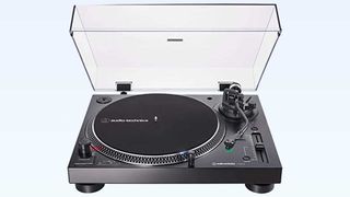 Audio-Technica AT-LP120XUSB turntable on a light blue background for best gifts for music lovers feature