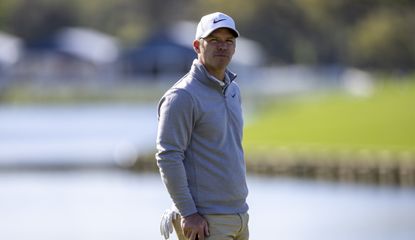 Casey looks on whilst holding his putter