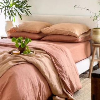 Hazelnut & Terracotta Bedding Bundle on a bed.