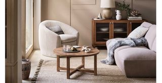 Neutral living room with boucle furniture supporting the comforting texture interior design trend 2024