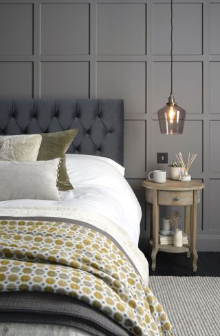 grey and ochre bedding with blankets