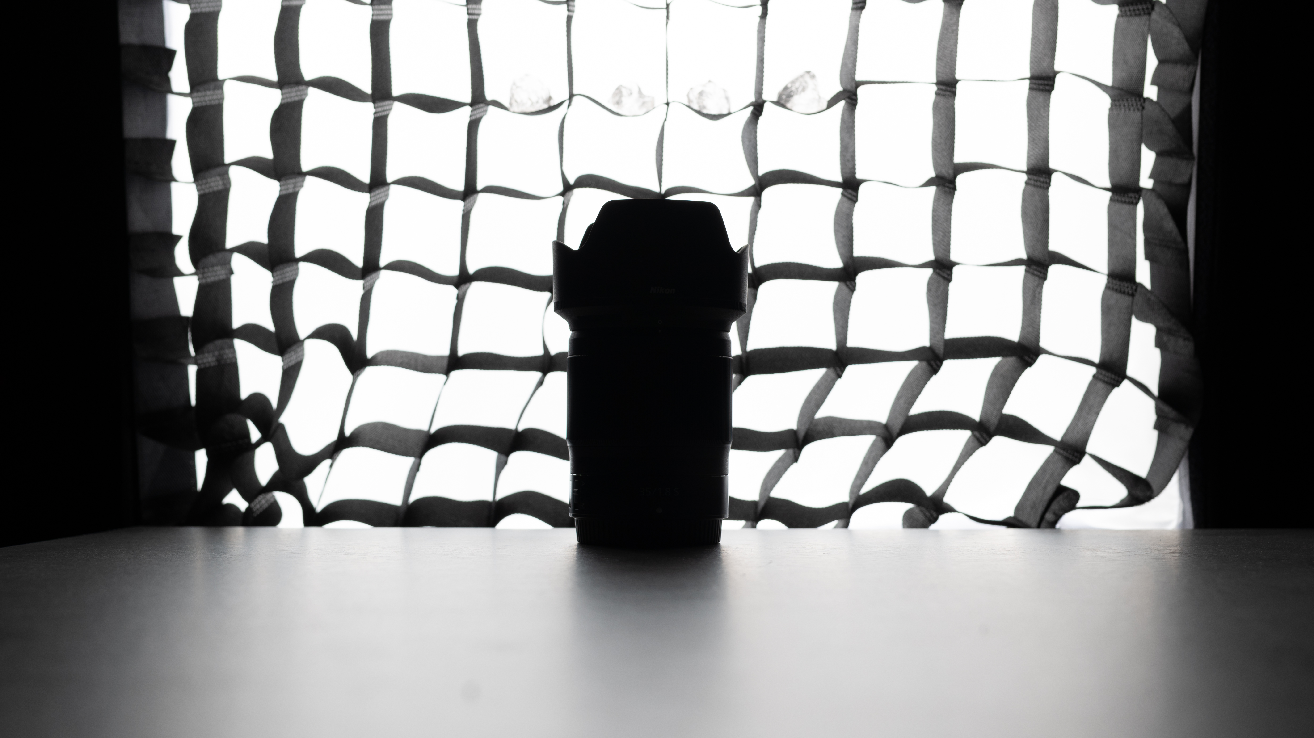 A photo of a backlit lens with a softbox in the background, taken on the Nikon Z50II