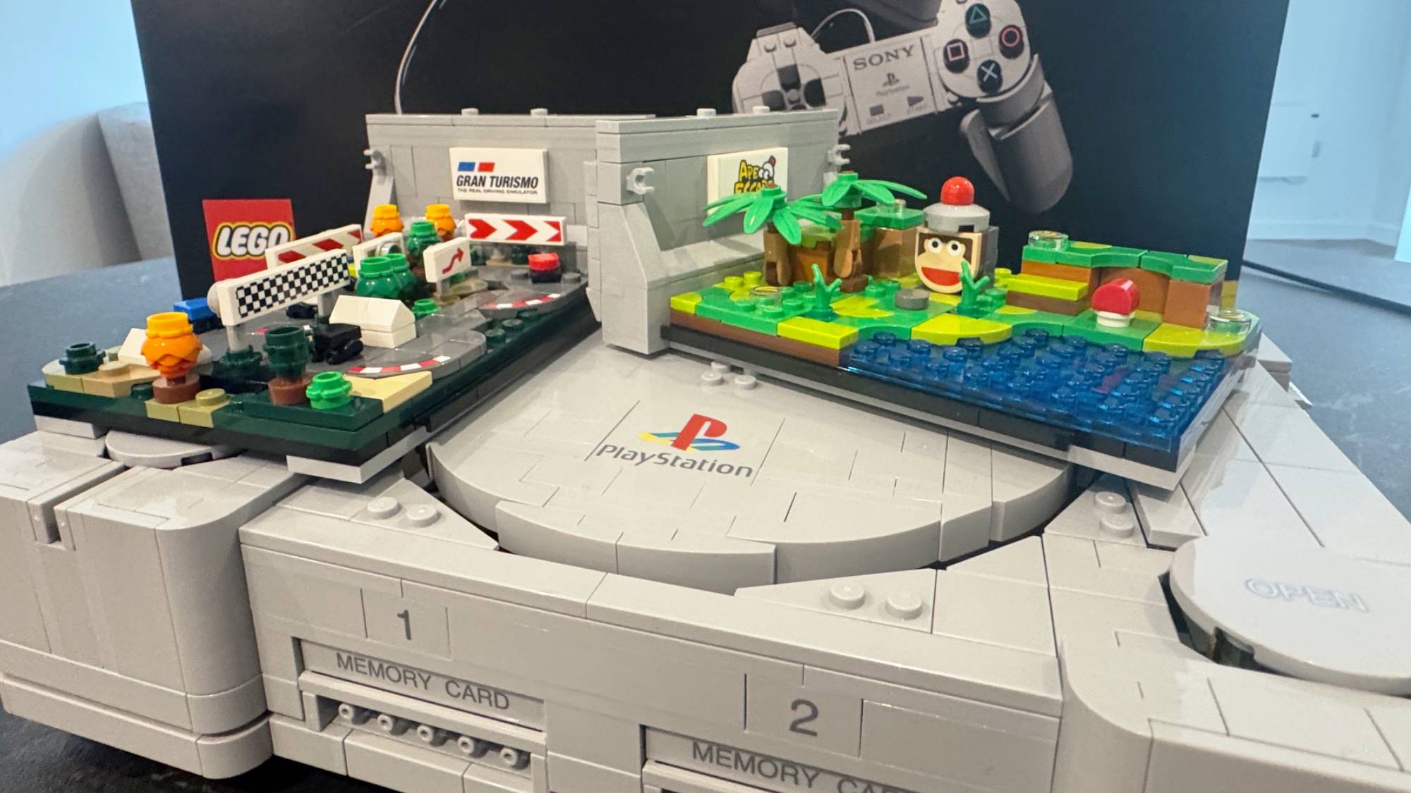 Lego PlayStation model on a table with the box in the background