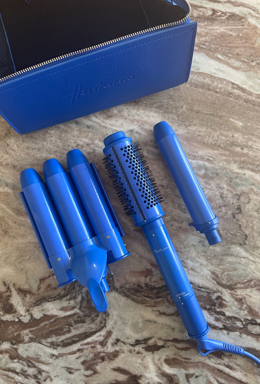 Hershesons the multi-styler long hair set on a marble table