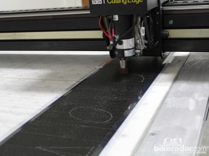 Swatches of carbon are cut by computer design before layup
