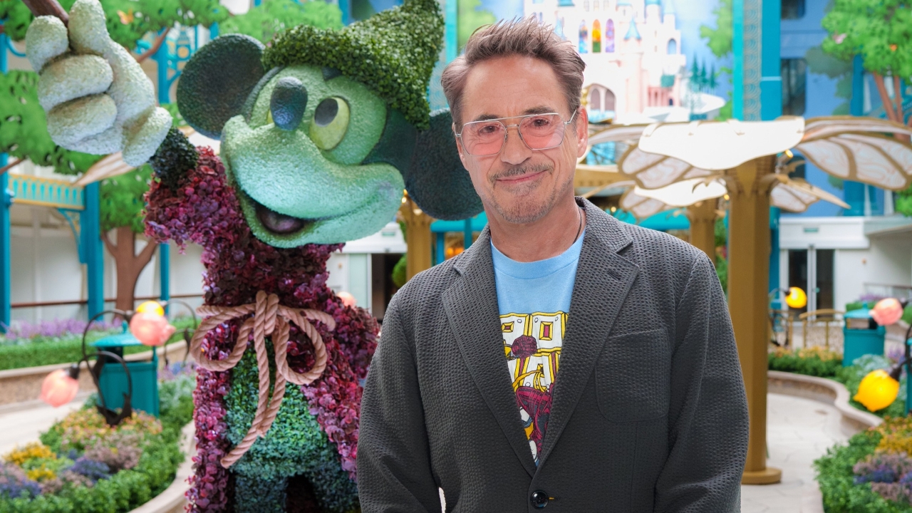 Robert Downey Jr. posing with Mickey Mouse topiary on board the Disney Adventure