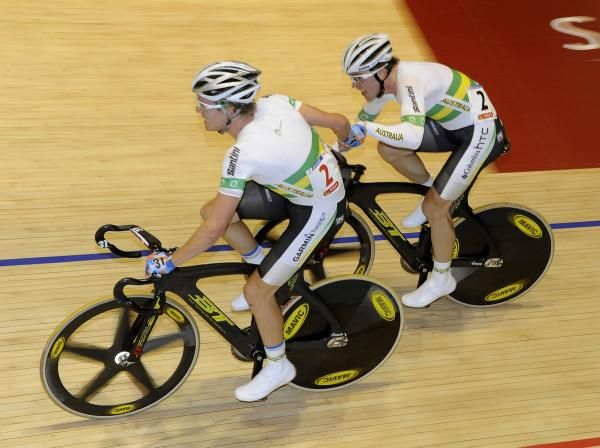 Australia's Cameron Meyer throws Leigh Howard into a turn as they try to take a lap.