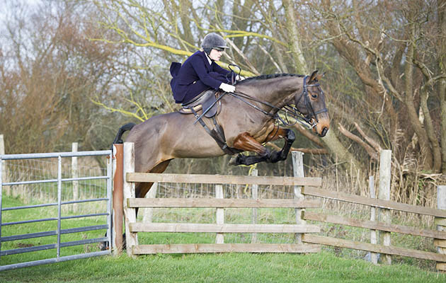 Charlotte Pearson-Wood pings over a decent set of rails out with the East Sussex and Romney Marsh from a meet near Rye