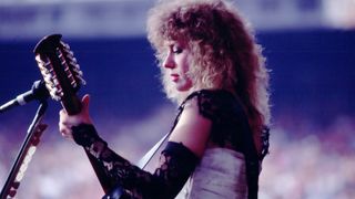 Nancy Wilson plays guitar as she performs onstage with Heart at Giants Stadium, East Rutherford, New Jersey, June 15, 1980.