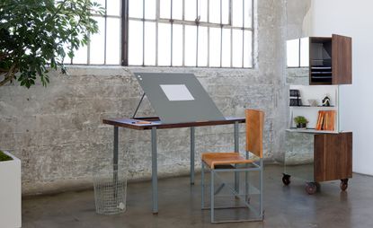 Convertible coffee table in desk form, alongside the multipurpose cabinet and step-ladder chair