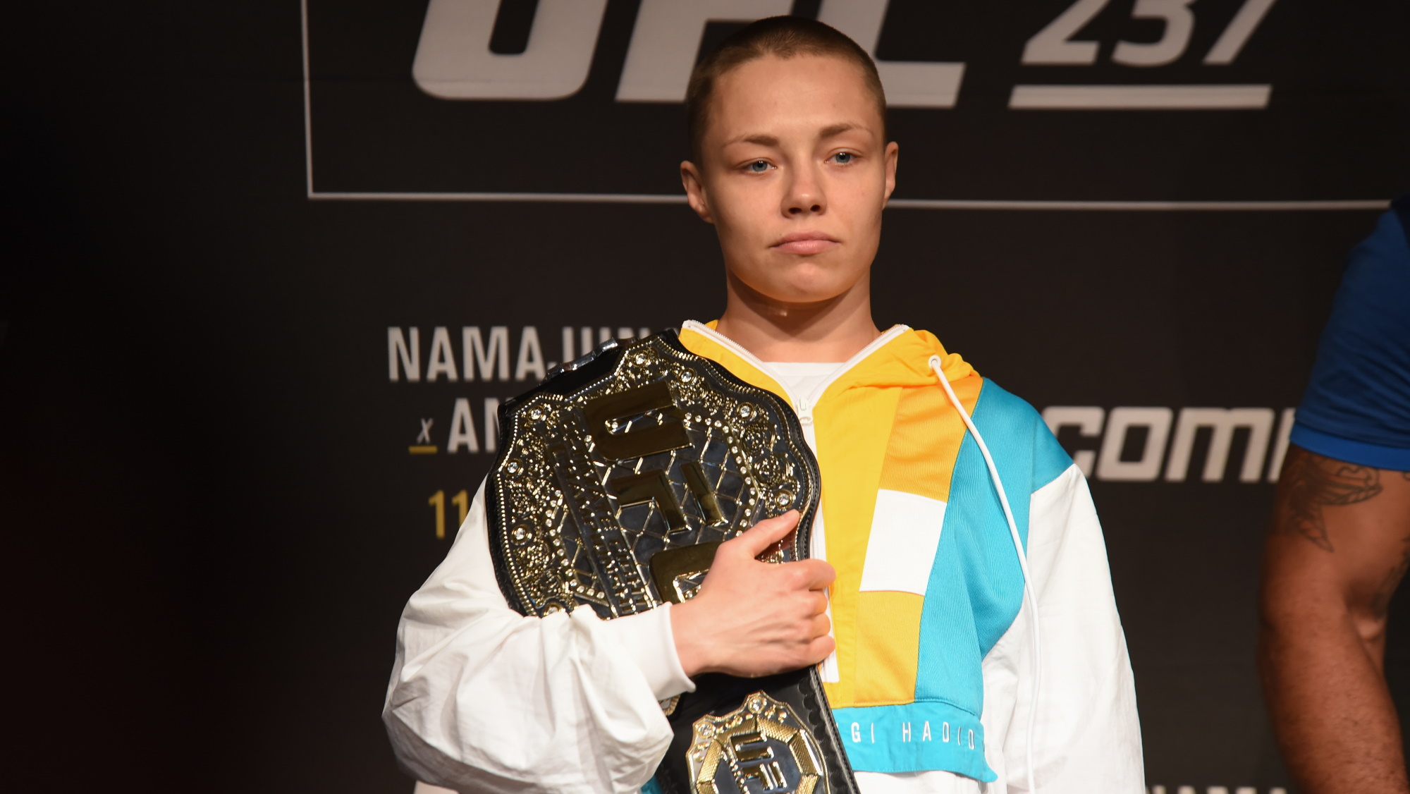 Rose Namajunas posing with a UFC title belt