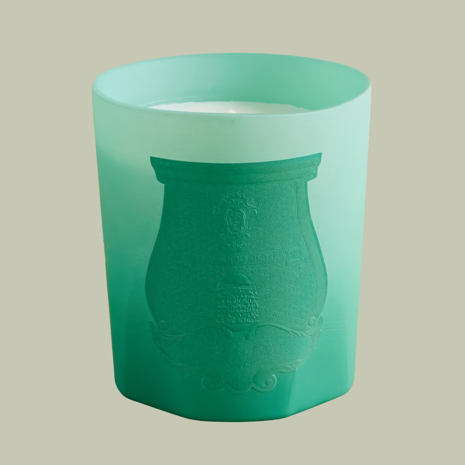 A green glass candle