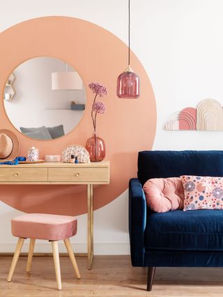 Maisons du monde blue sofa with pink wall and scatter cushion