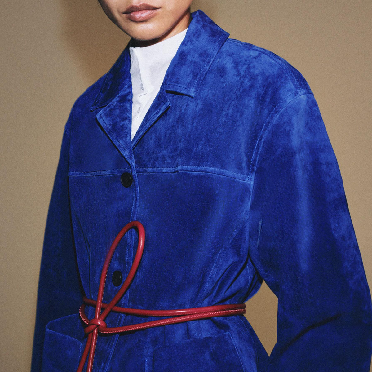 Woman in a zara blue suede jacket