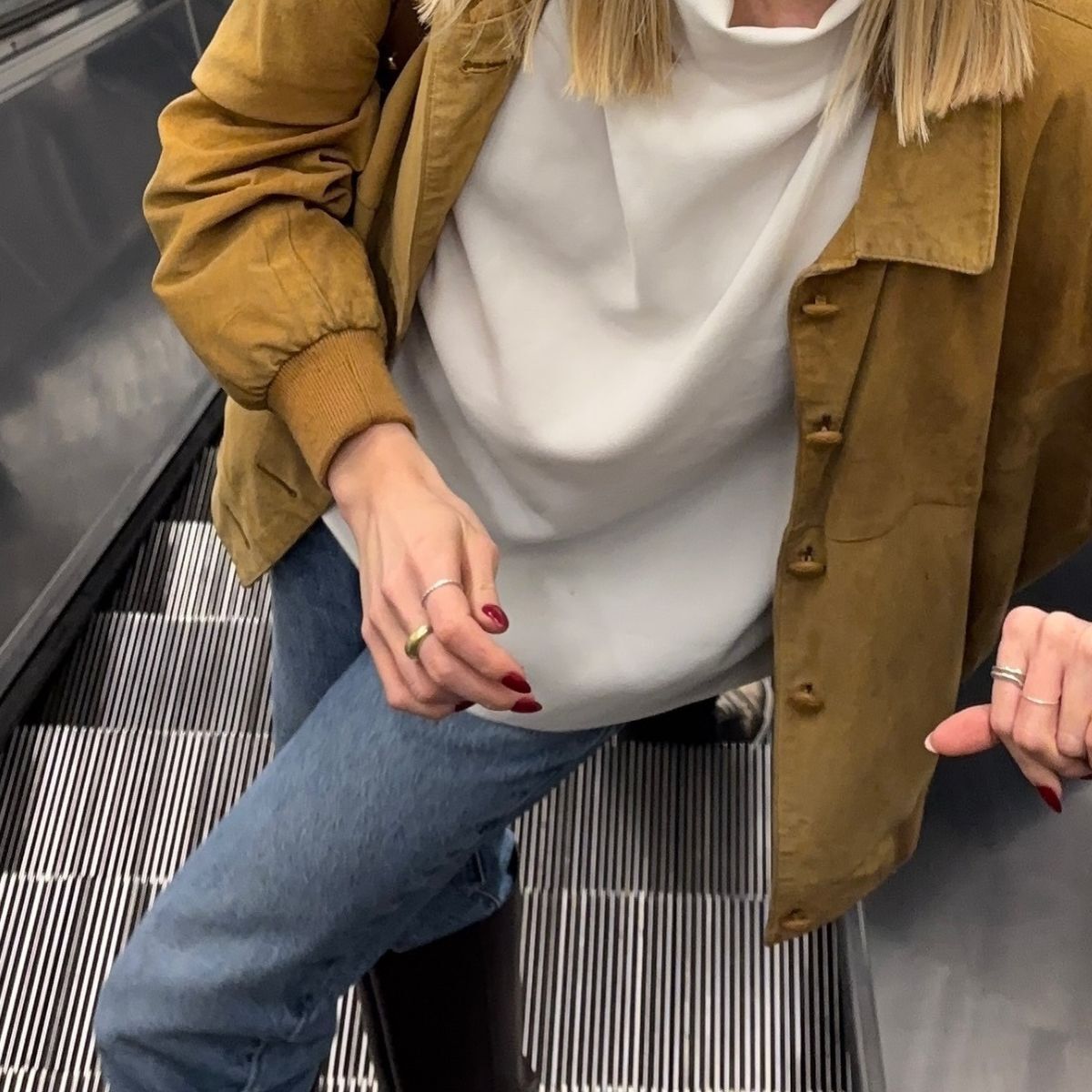 Fashion person Lou Northcote wears the tucked knee high boot trend. 