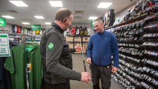 golfer getting advice on golf shaft