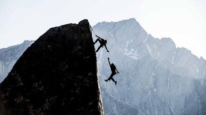 person falling off of cliff