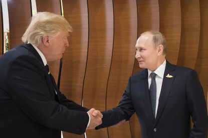 President Trump and Vladimir Putin shake hands at the G-20